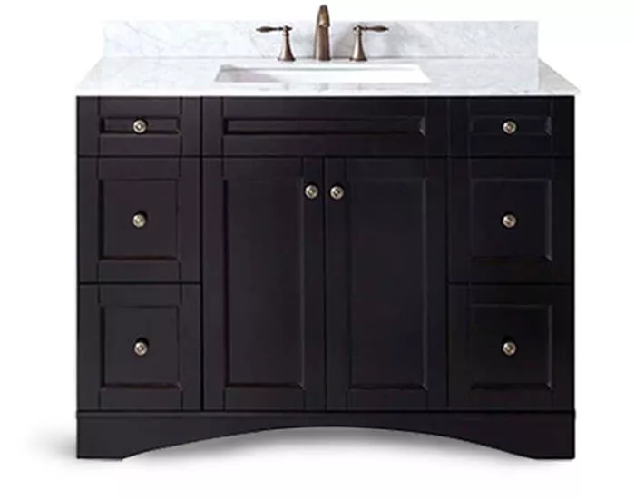 Black wooden cabinet with a white marble countertop and sink displayed on a white setting in Al-Ain.