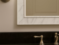 Compact size of a lighted mirror provides a relaxing and refreshing space in a bathroom.