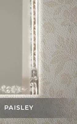 Wall mounted front lit up mirror with a paisley patterned light frame in Bahrain.