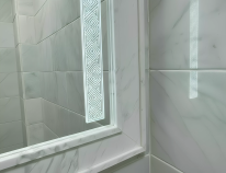 Thumbnail of a frosted-edge LED mirror that fills the space with a gentle glow above a single sink.